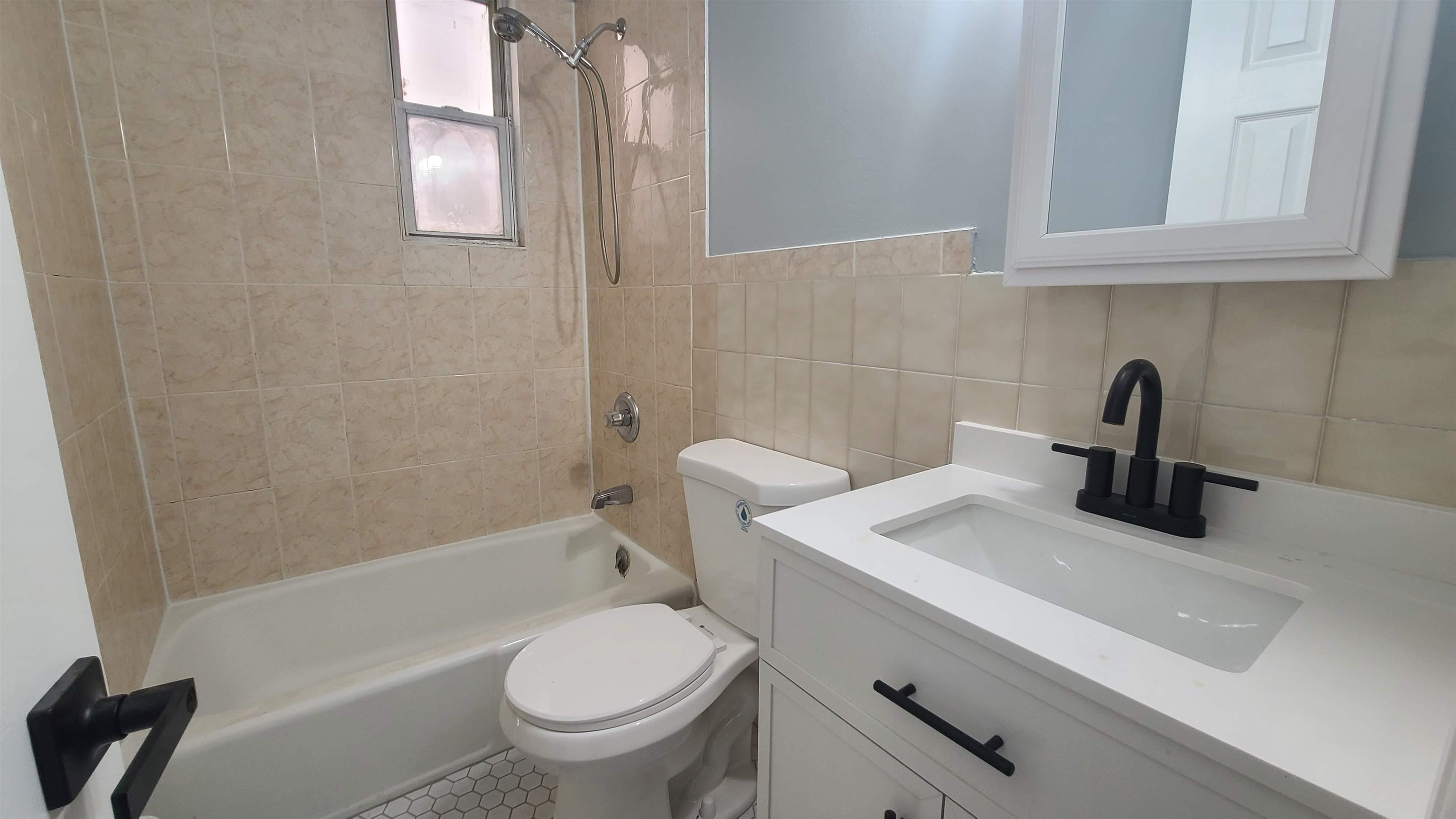 6206 Newkirk Avenue, Unit 1 North Bergen, NJ 07047 - Photo 17 of 20 a bathroom with a sink a toilet and bathtub