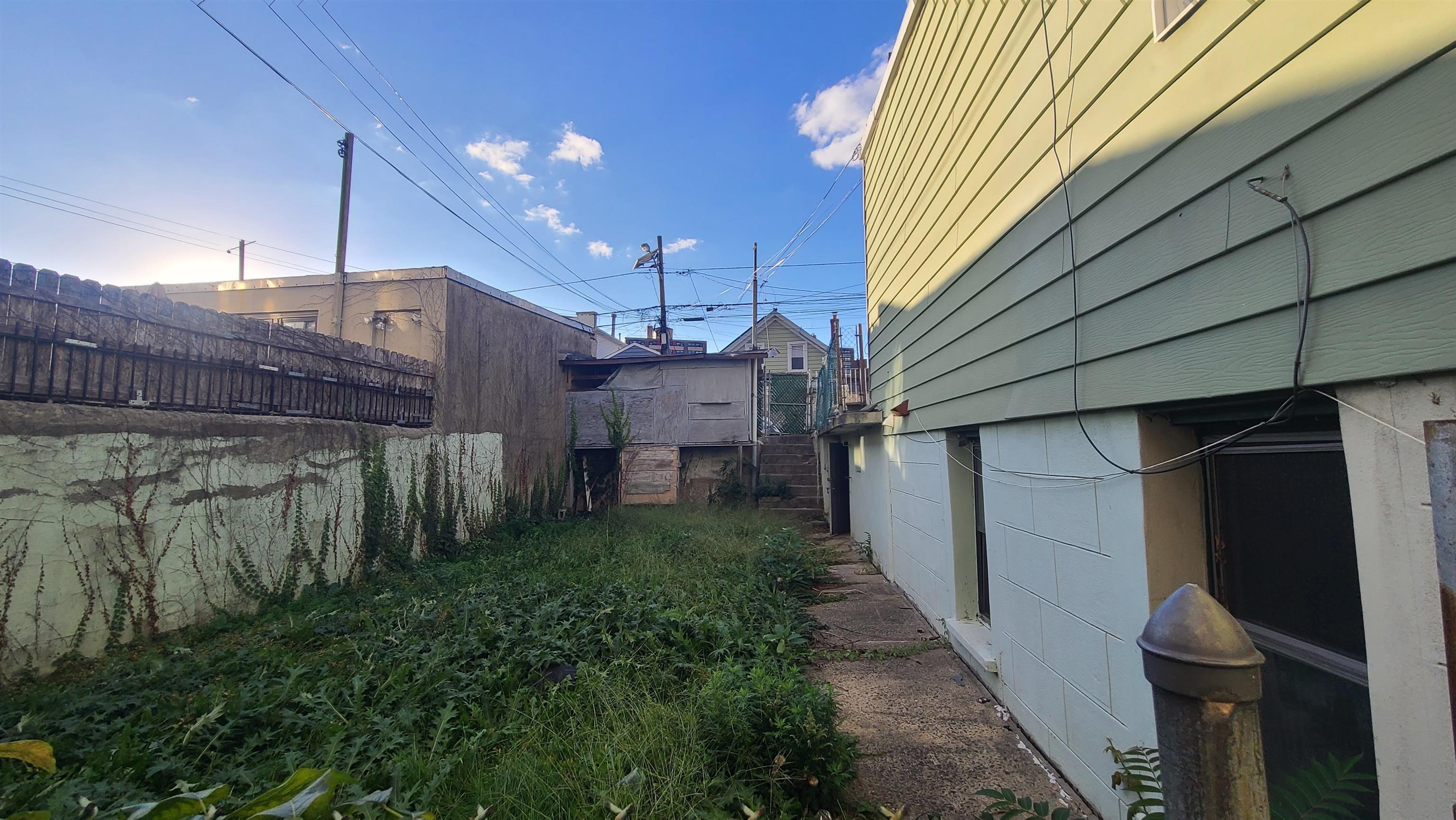 6206 Newkirk Avenue, Unit 1 North Bergen, NJ 07047 - Photo 20 of 20 a view of a house with a backyard