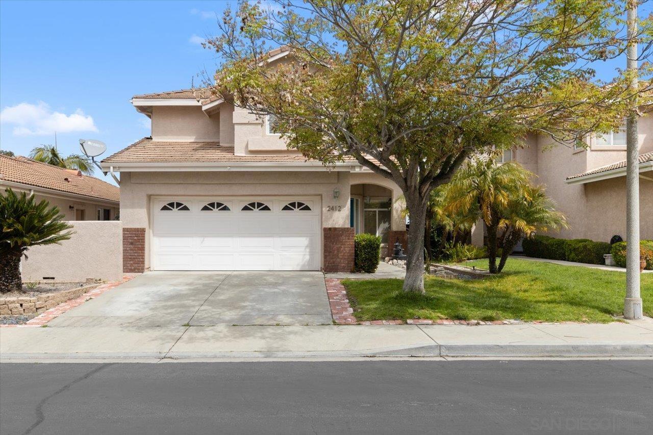 2412 Starlight Glen Escondido, CA 92026 - Photo 1 of 48 a front view of a house with a yard