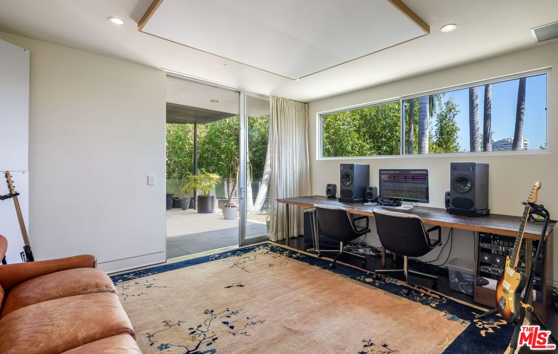 1012 Wallace Ridge Beverly Hills, CA 90210 - Photo 18 of 41 a view of a workspace with furniture and a window