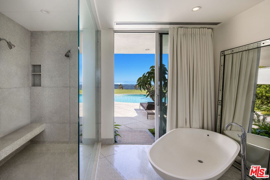 1012 Wallace Ridge Beverly Hills, CA 90210 - Photo 24 of 41 a bathroom with a tub and shower