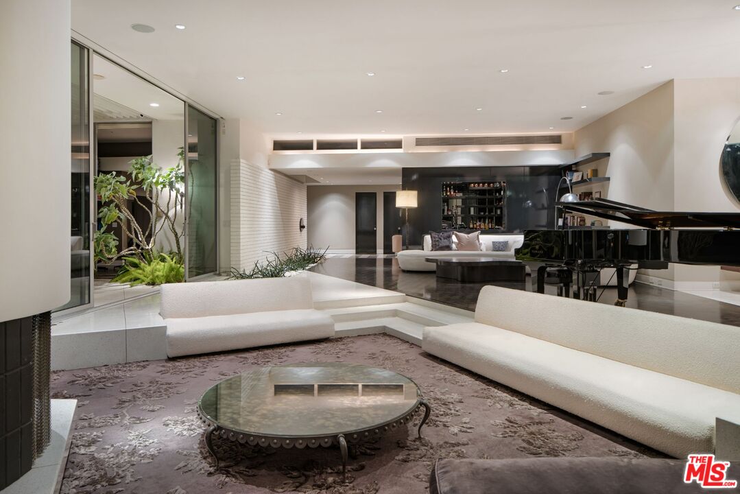 1012 Wallace Ridge Beverly Hills, CA 90210 - Photo 37 of 41 a living room with furniture and a fireplace