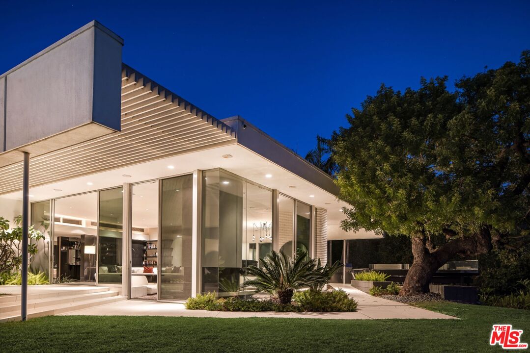 1012 Wallace Ridge Beverly Hills, CA 90210 - Photo 38 of 41 a view of a patio with table and chairs and potted plants