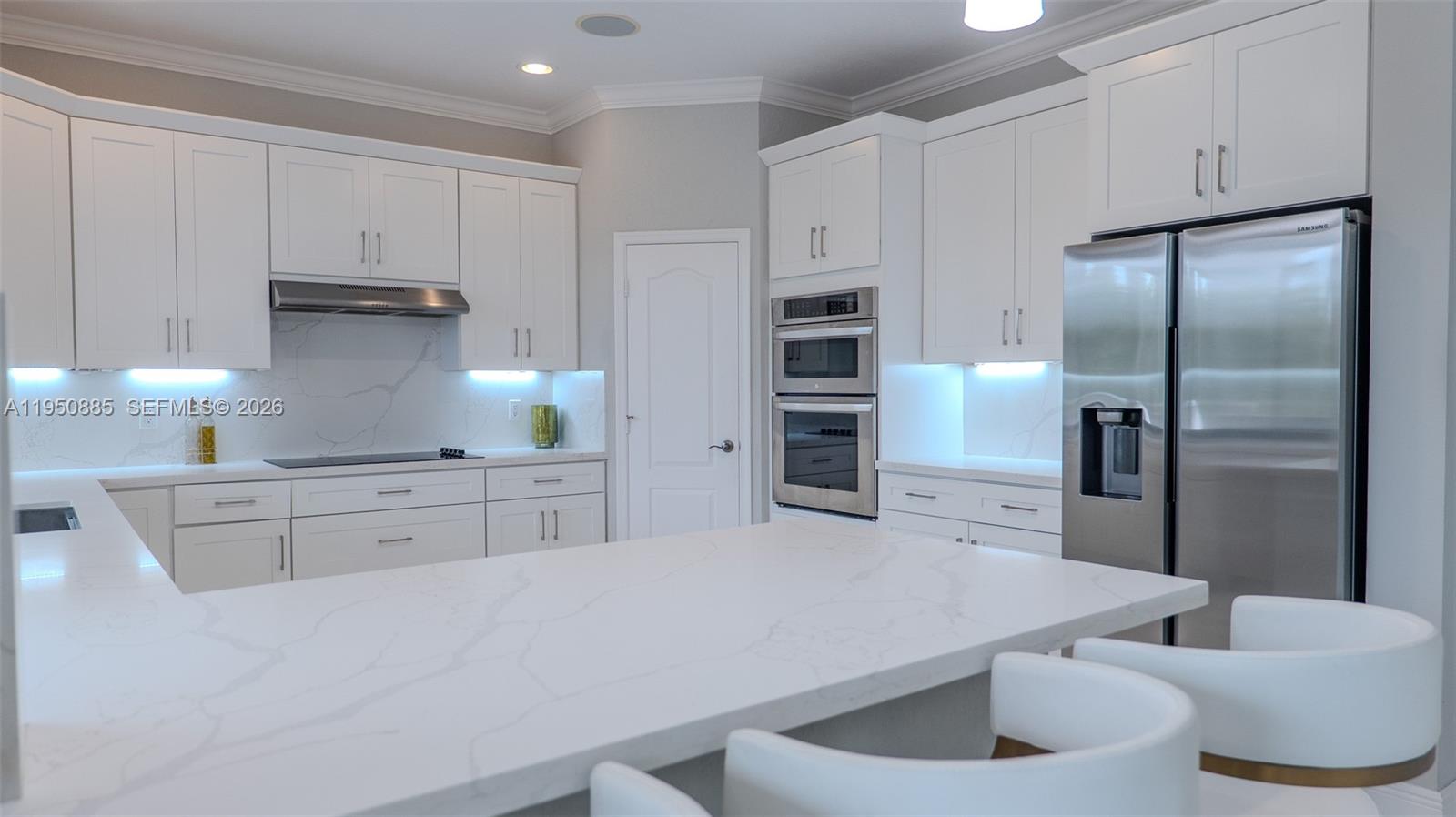 18540 Southwest 43rd Street Miramar, FL 33029 - Photo 11 of 56 a kitchen with stainless steel appliances a refrigerator sink and cabinets