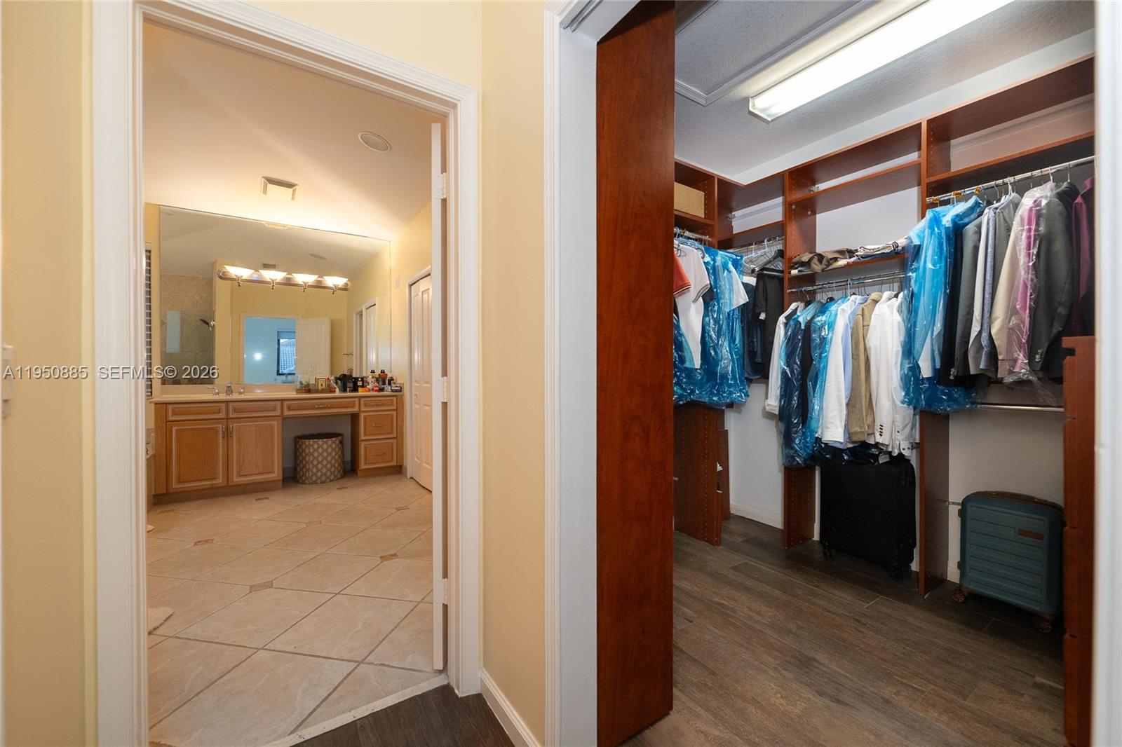 18540 Southwest 43rd Street Miramar, FL 33029 - Photo 29 of 56 a view of walk in closet with clothes and shoes