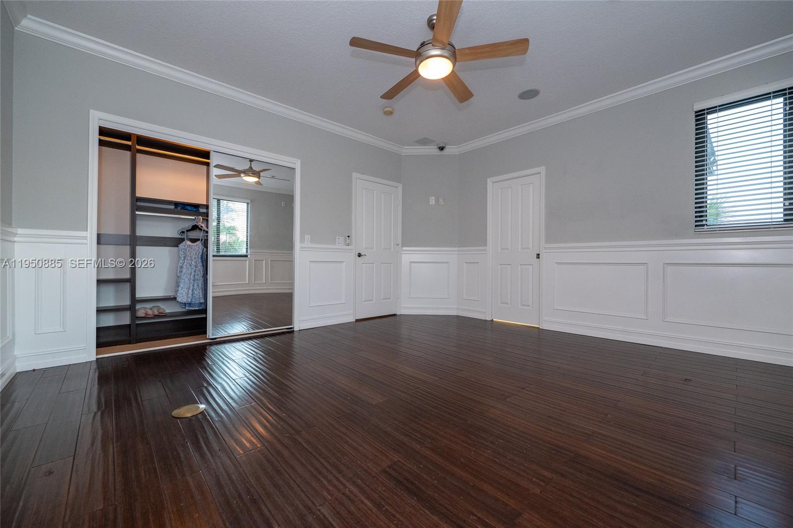 18540 Southwest 43rd Street Miramar, FL 33029 - Photo 32 of 56 a view of empty room with wooden floor and fan