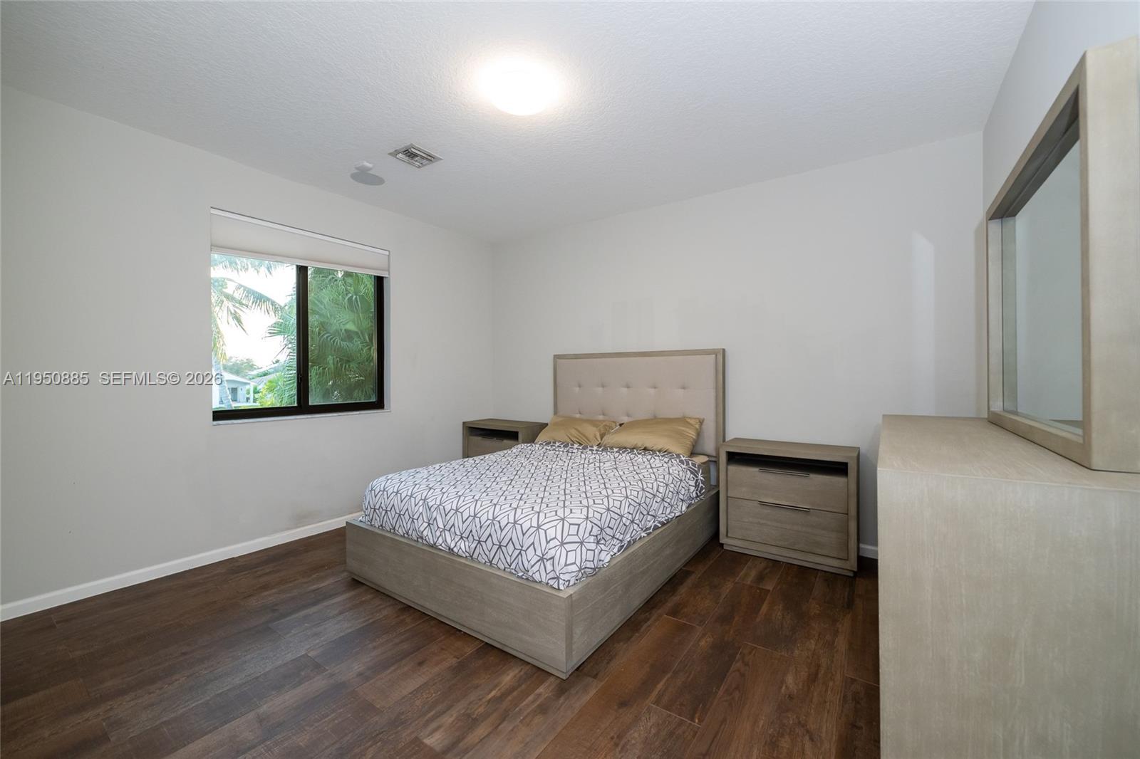 18540 Southwest 43rd Street Miramar, FL 33029 - Photo 33 of 56 a bedroom with a bed and window