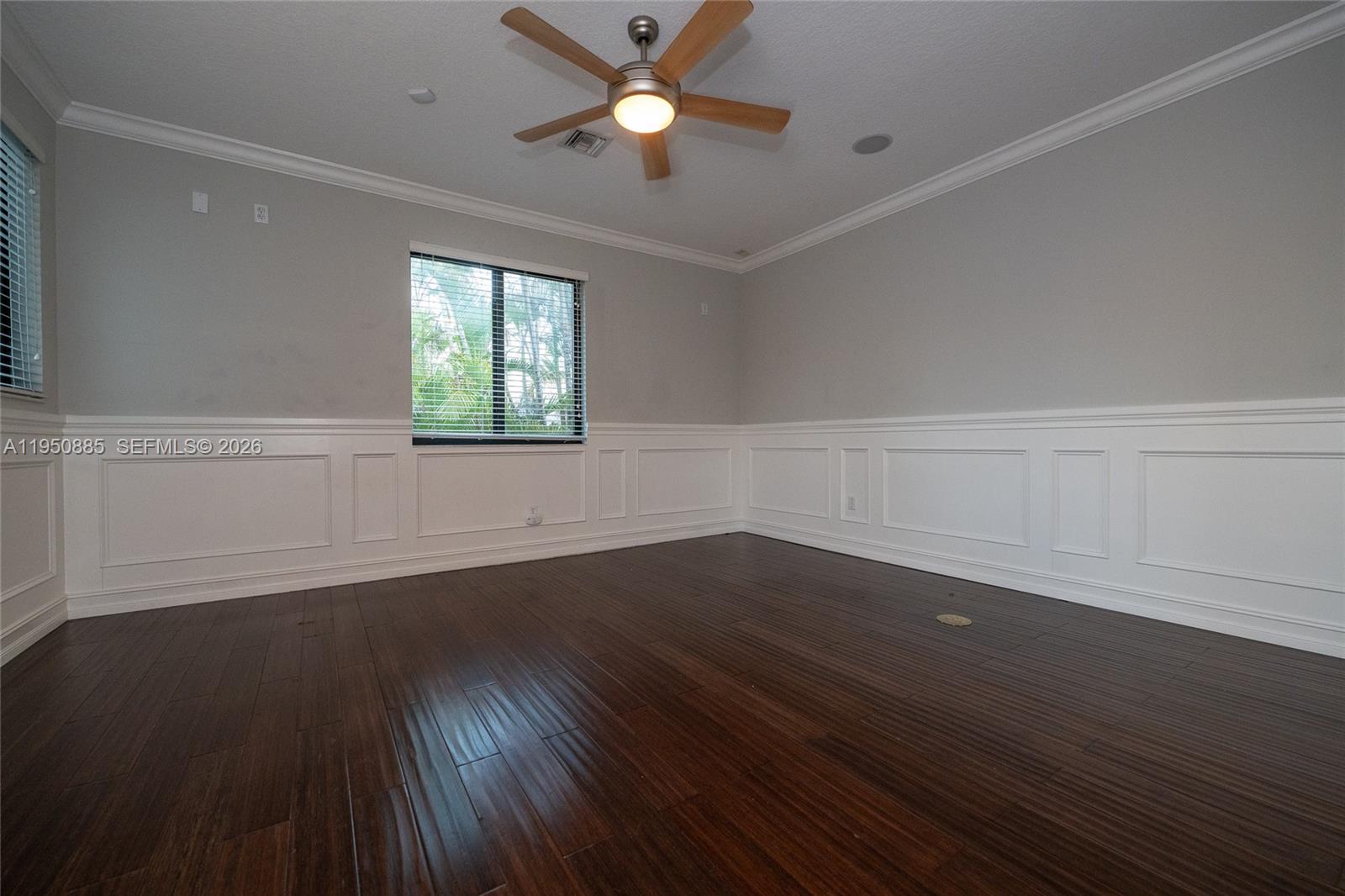 18540 Southwest 43rd Street Miramar, FL 33029 - Photo 37 of 56 a view of an empty room with wooden floor and a window