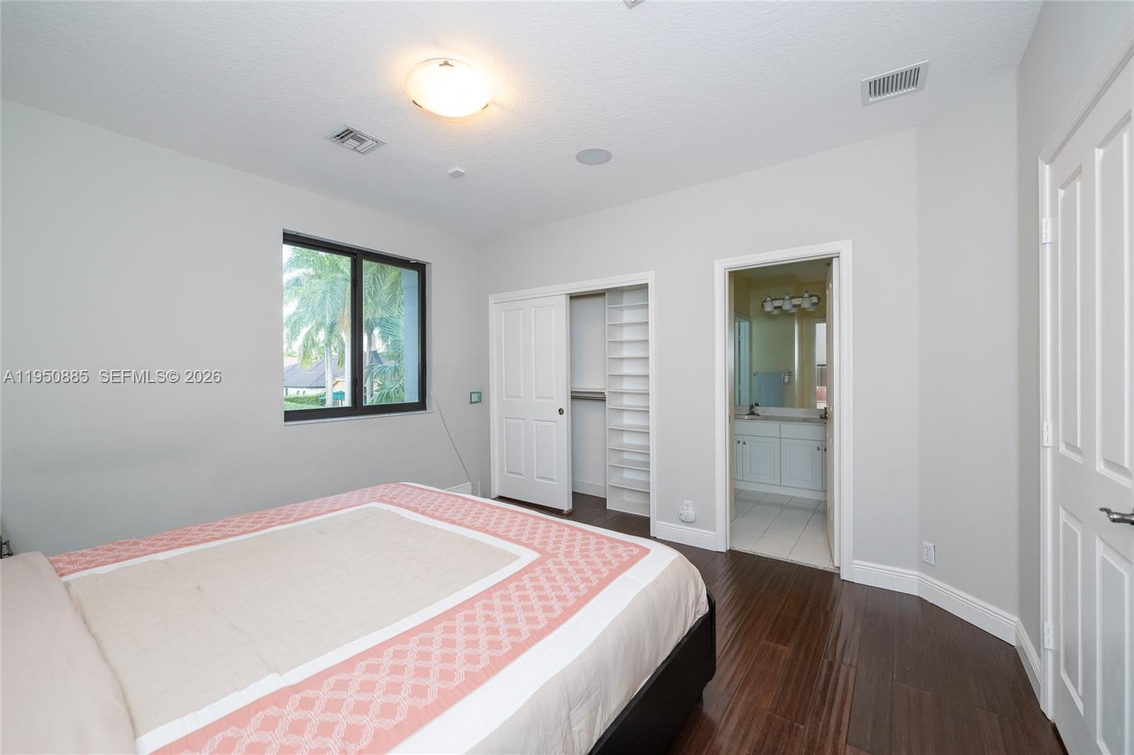 18540 Southwest 43rd Street Miramar, FL 33029 - Photo 38 of 56 a bedroom with a bed and a window
