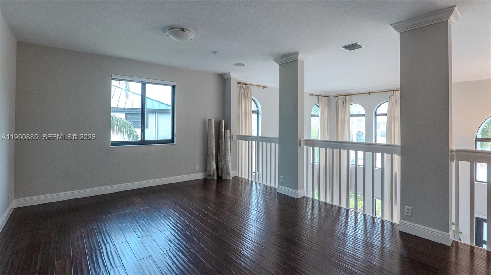 18540 Southwest 43rd Street Miramar, FL 33029 - Photo 40 of 56 a view of an empty room with wooden floor and a window