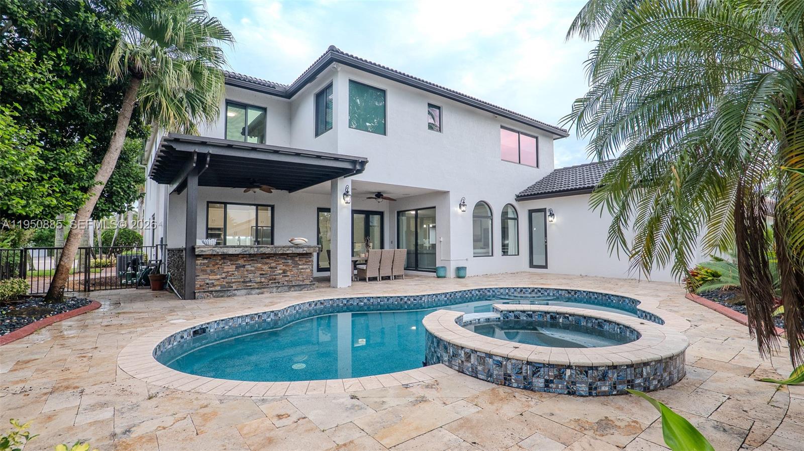18540 Southwest 43rd Street Miramar, FL 33029 - Photo 49 of 56 a view of a house with backyard and sitting area