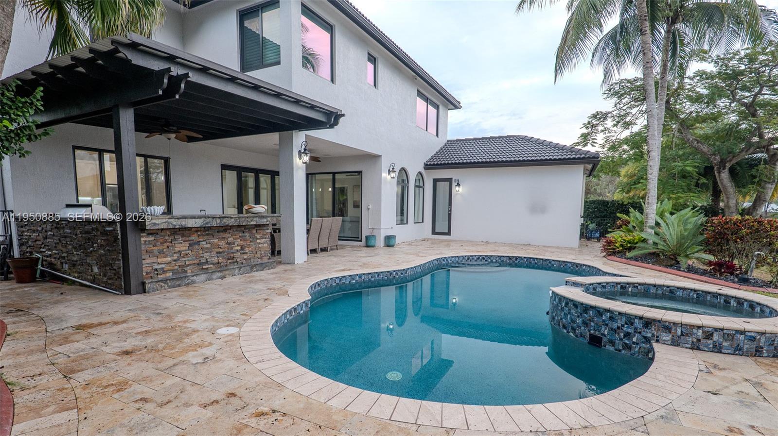 18540 Southwest 43rd Street Miramar, FL 33029 - Photo 50 of 56 a view of a house with pool and sitting area