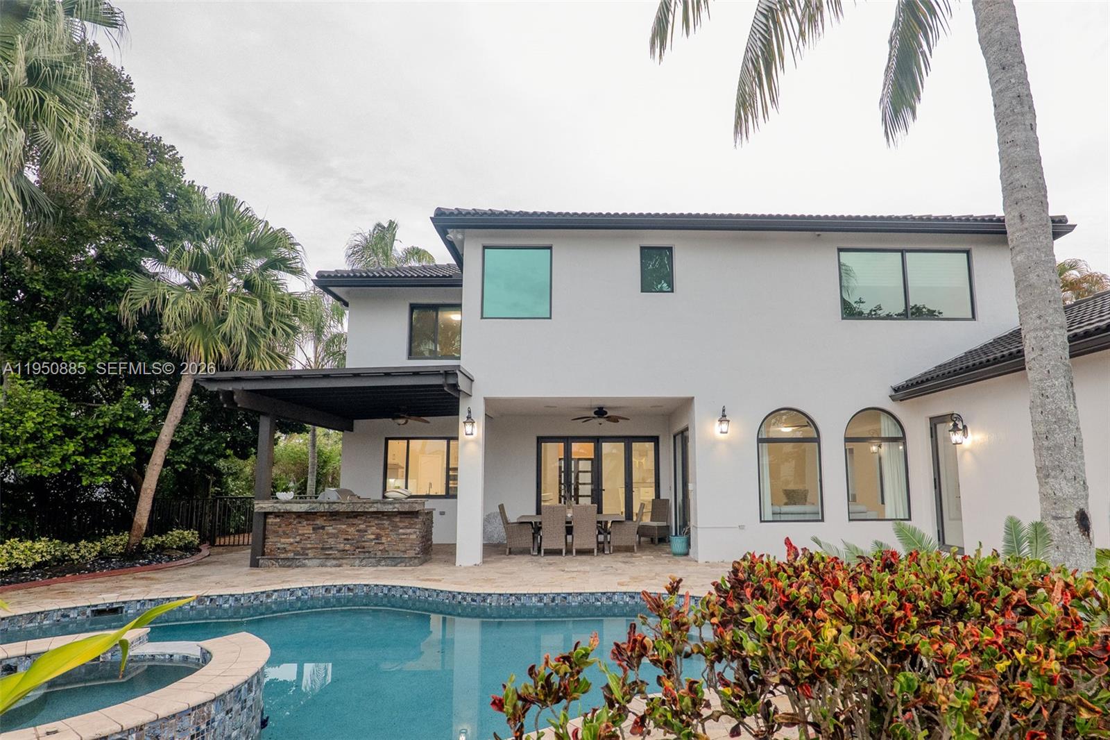 18540 Southwest 43rd Street Miramar, FL 33029 - Photo 51 of 56 a front view of a house with garden