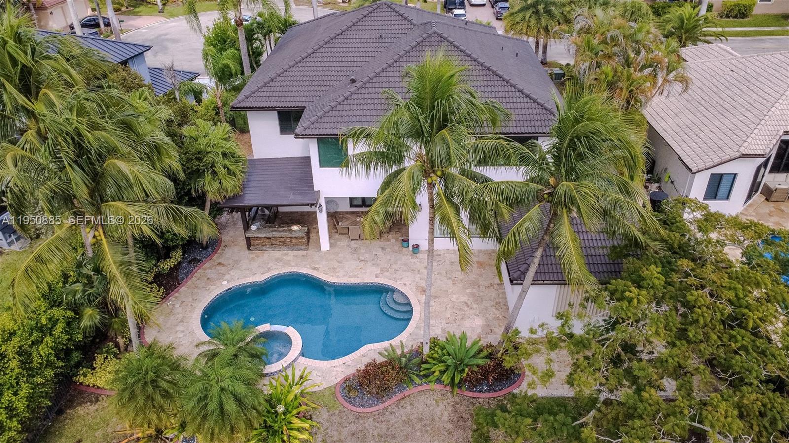 18540 Southwest 43rd Street Miramar, FL 33029 - Photo 52 of 56 an aerial view of a house with swimming pool garden and patio