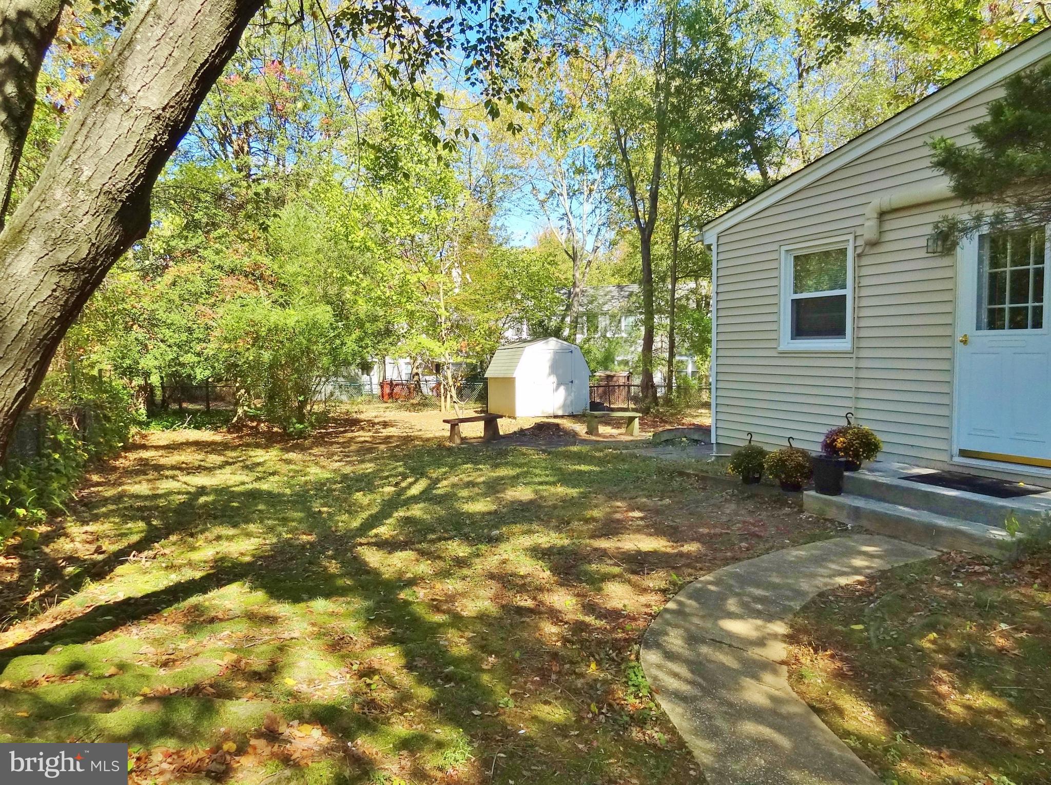 Fenced side and back yards