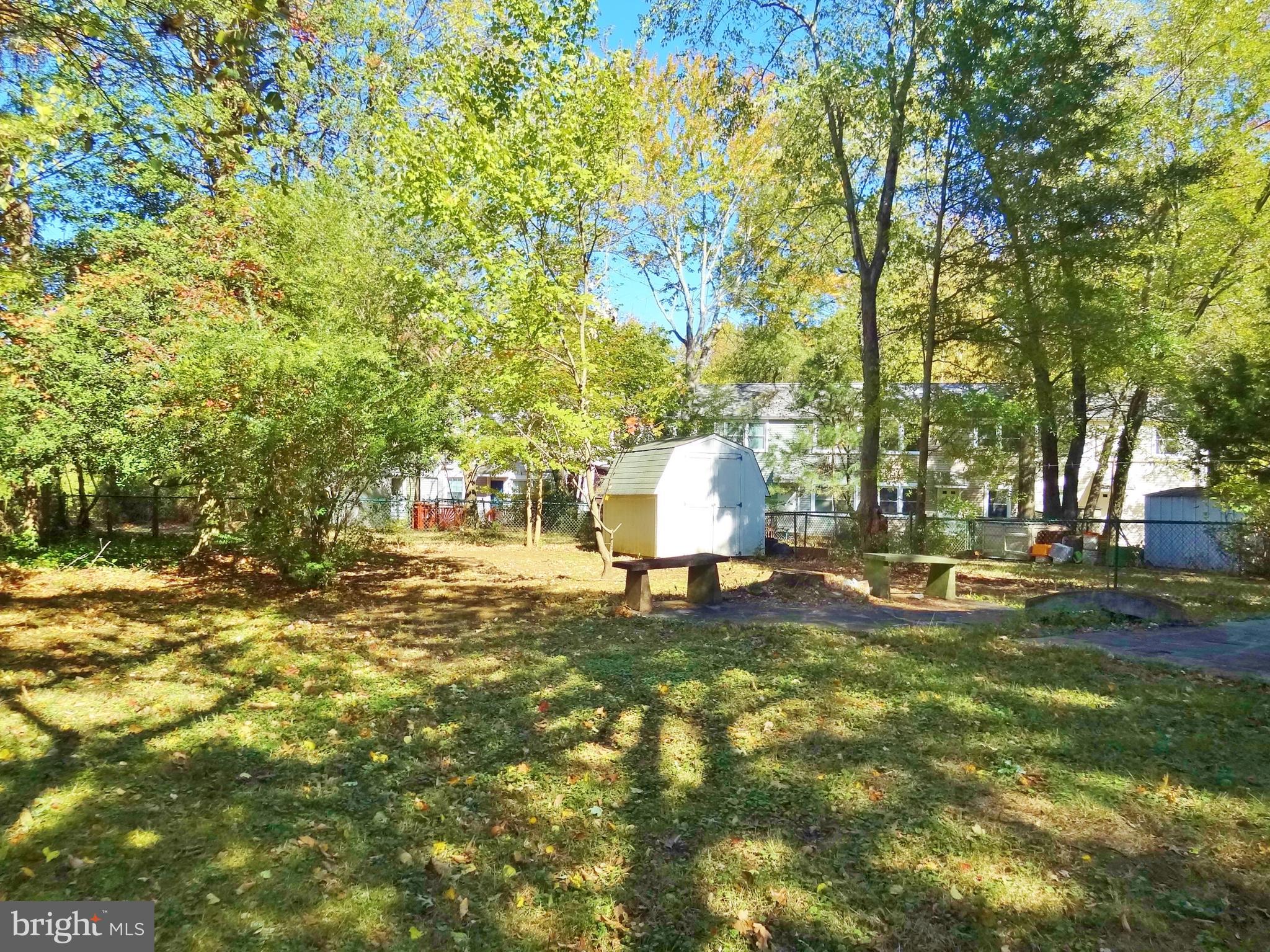 36 Ridge Road, Unit A Greenbelt, MD 20770 - Photo 2 of 14 Fenced backyard with shed.