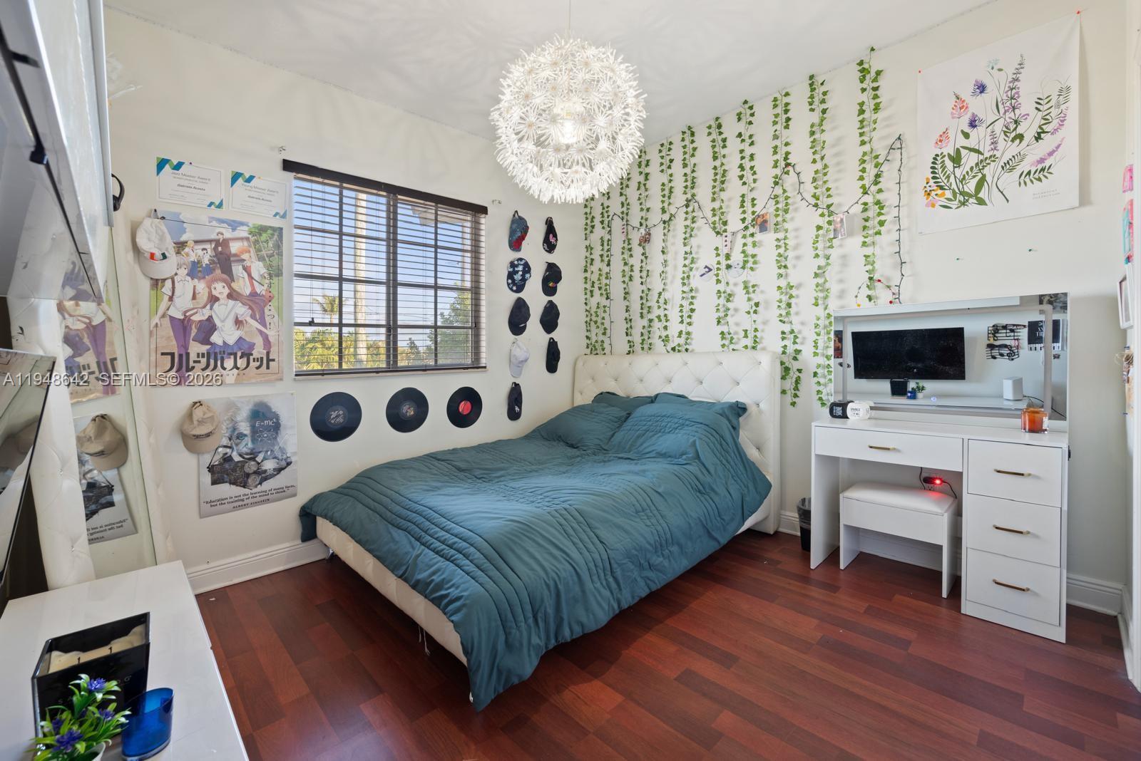 1360 Southwest 142nd Avenue Miami, FL 33184 - Photo 22 of 54 a bedroom with a bed and a flat tv screen on the dresser