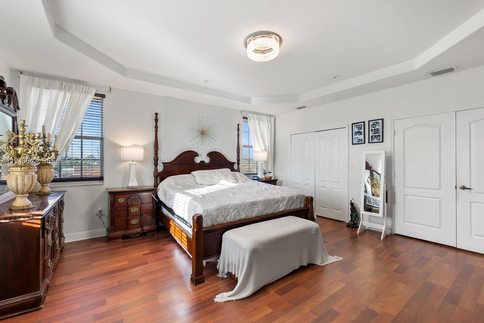 1360 Southwest 142nd Avenue Miami, FL 33184 - Photo 29 of 54 a bedroom with a bed and wooden floor