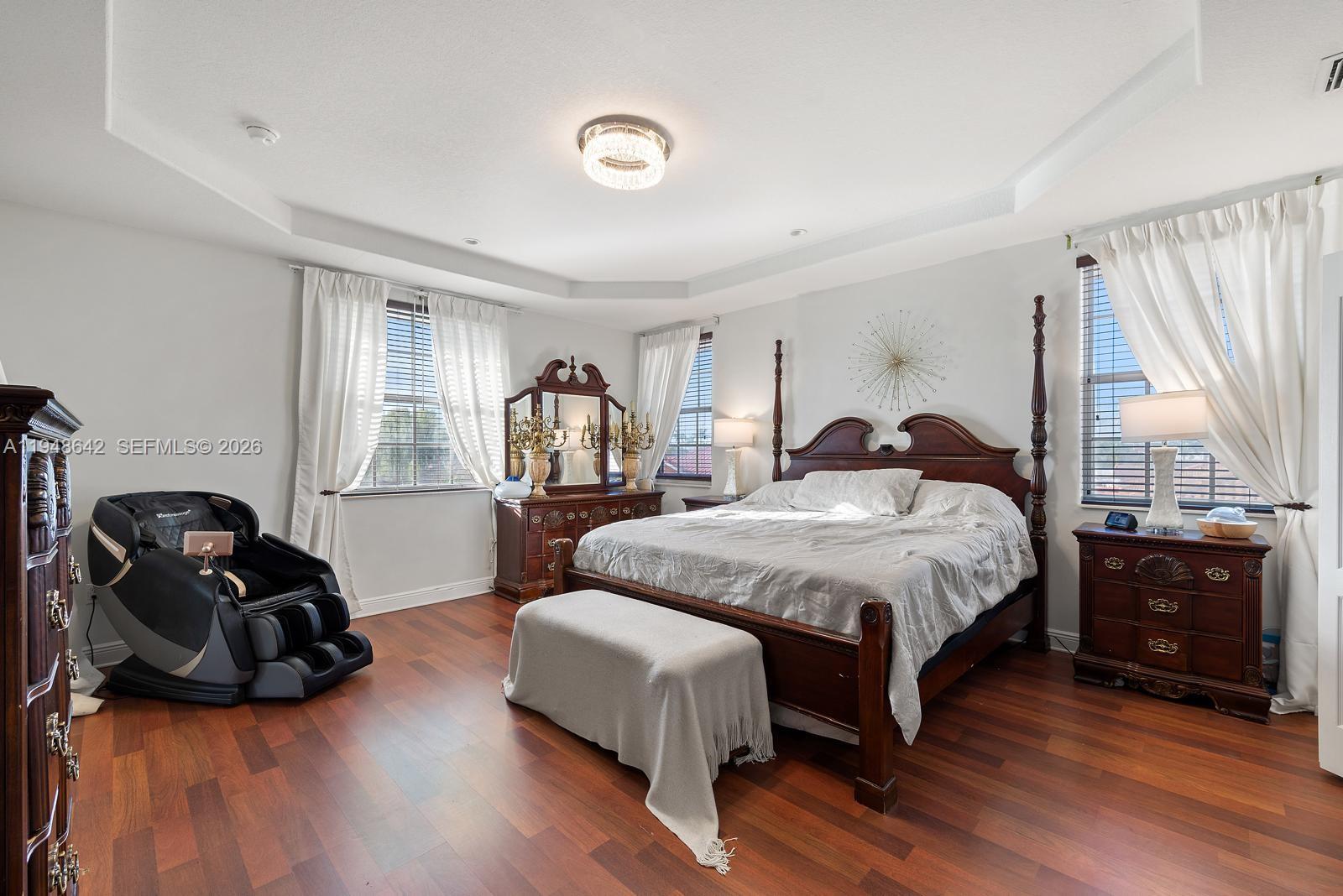 1360 Southwest 142nd Avenue Miami, FL 33184 - Photo 30 of 54 a spacious bedroom with a bed a table and a window