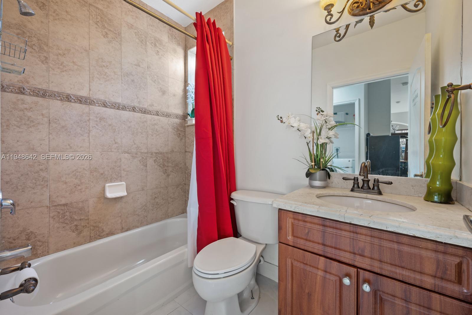 1360 Southwest 142nd Avenue Miami, FL 33184 - Photo 34 of 54 a bathroom with a sink a toilet and a bathtub
