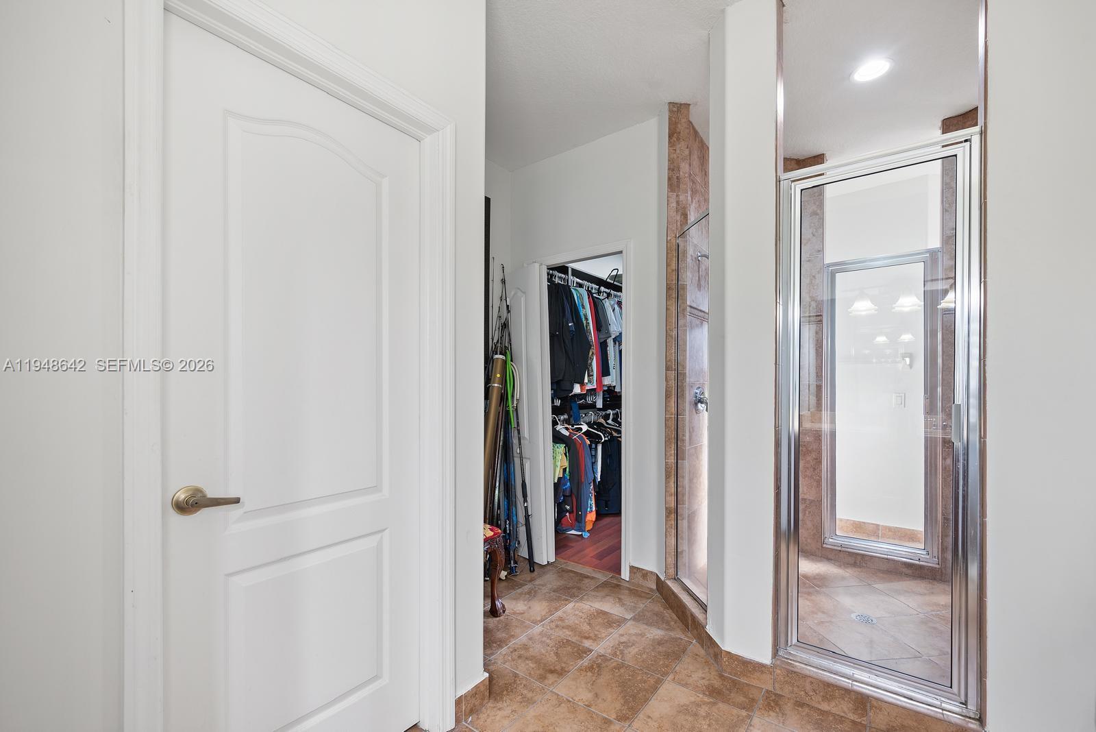1360 Southwest 142nd Avenue Miami, FL 33184 - Photo 35 of 54 a view of a hallway with wooden shelves