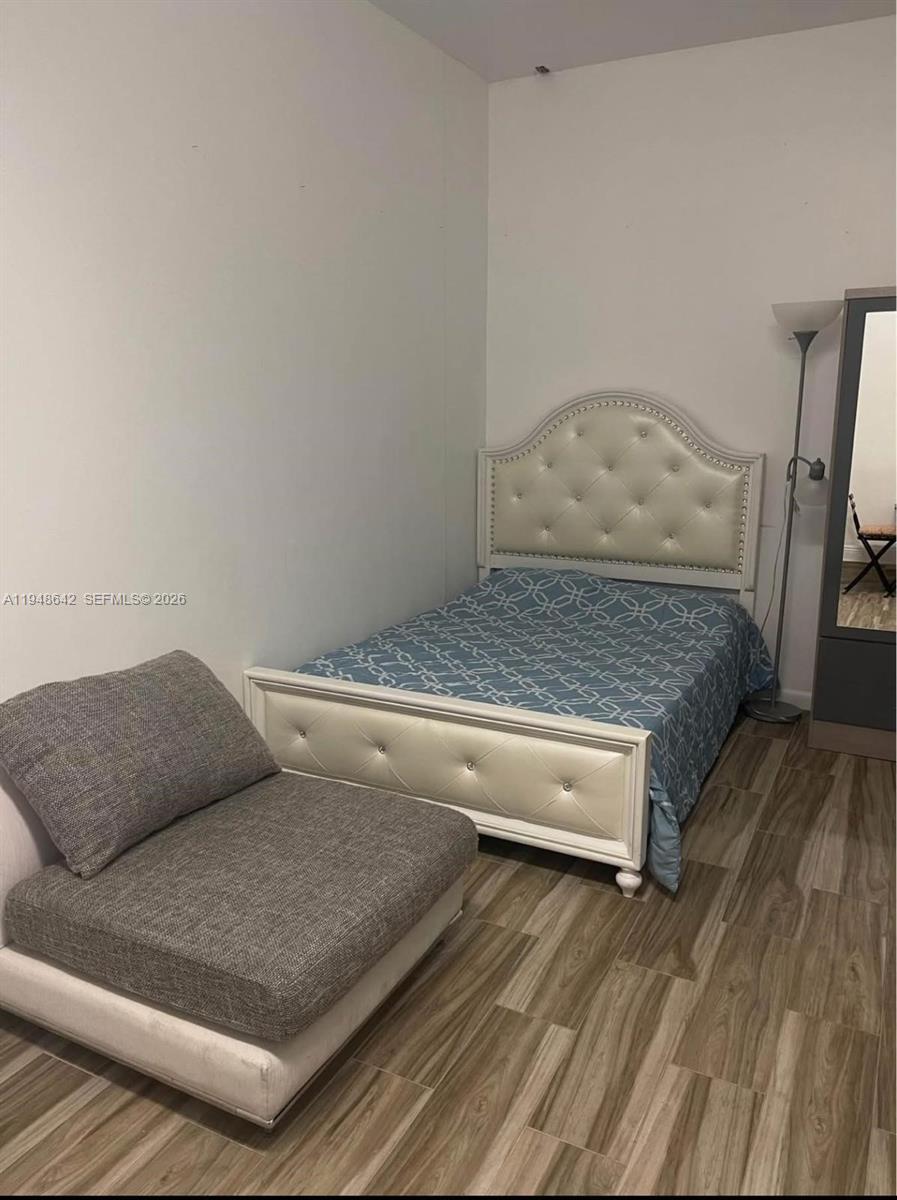 1360 Southwest 142nd Avenue Miami, FL 33184 - Photo 38 of 54 a living room with furniture and a wooden floor