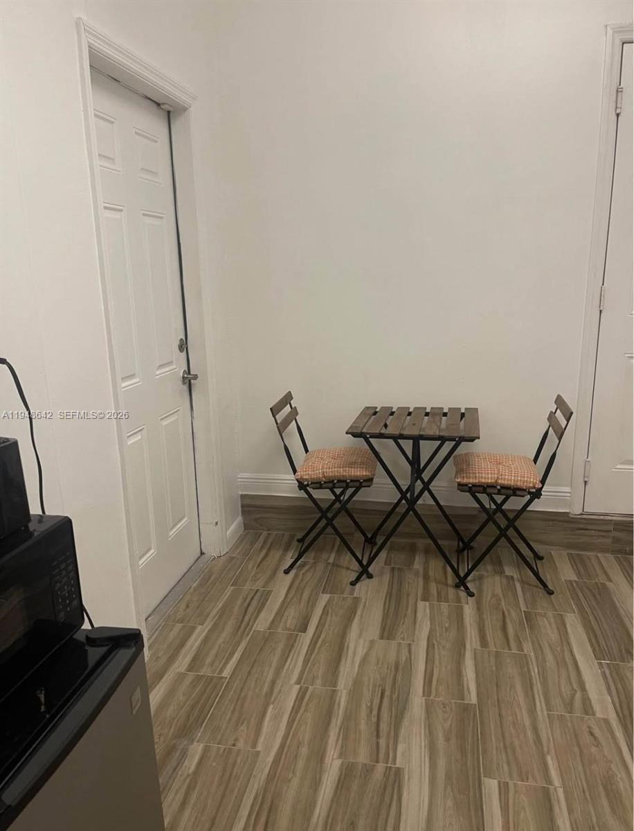 1360 Southwest 142nd Avenue Miami, FL 33184 - Photo 41 of 54 a view of a workspace with wooden floor