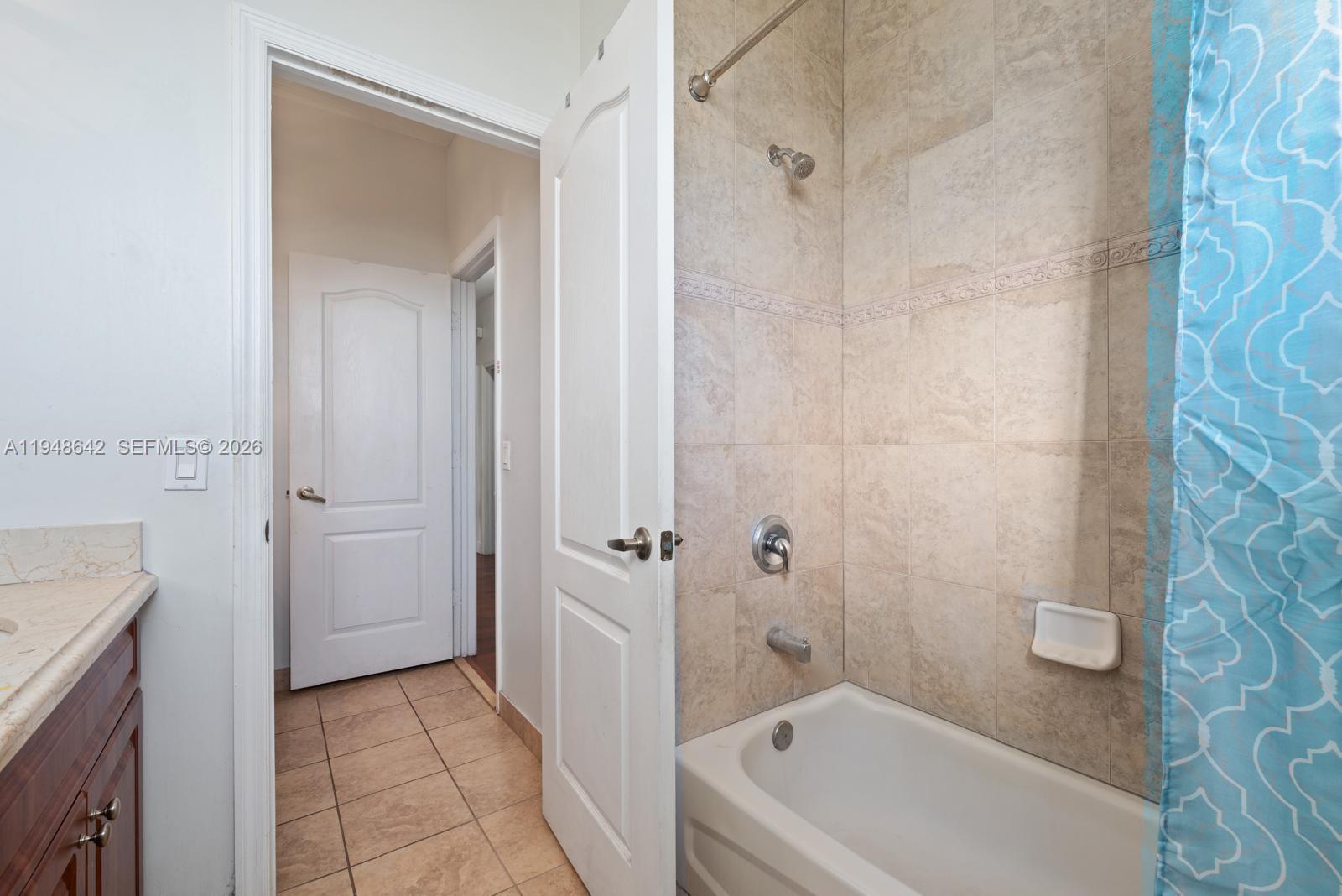 1360 Southwest 142nd Avenue Miami, FL 33184 - Photo 42 of 54 a bathroom with a bathtub and shower