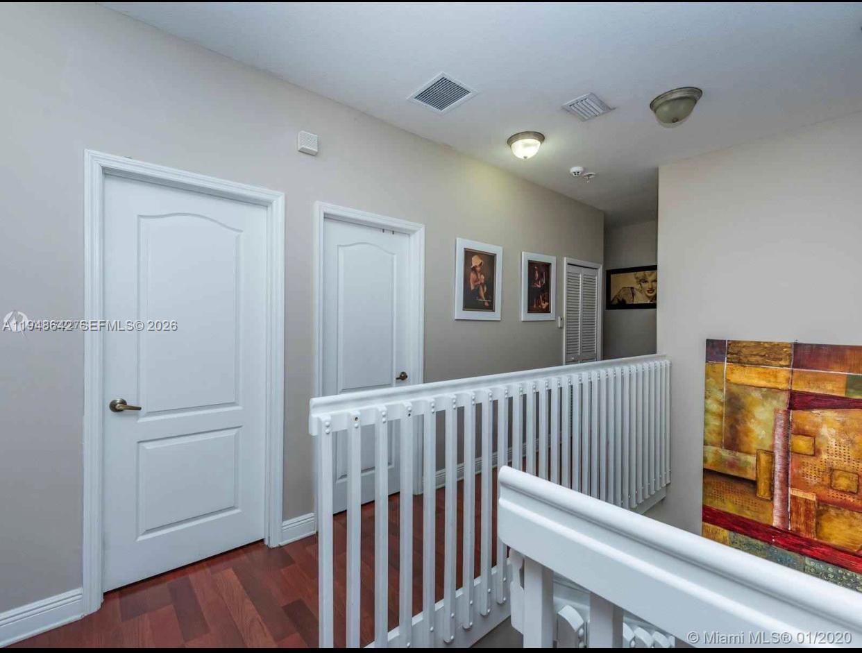 1360 Southwest 142nd Avenue Miami, FL 33184 - Photo 47 of 54 a view of a hallway with windows