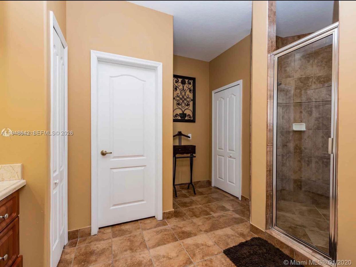 1360 Southwest 142nd Avenue Miami, FL 33184 - Photo 53 of 54 a view of a bathroom with a glass door