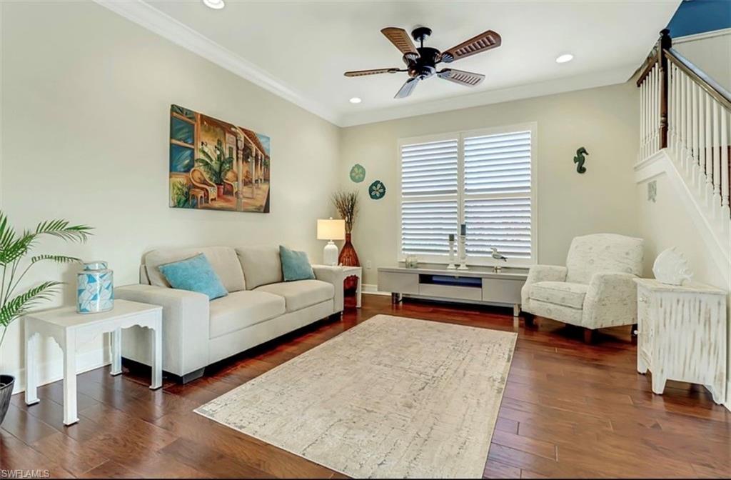 3402 Tigris Lane Naples, FL 34119 - Photo 13 of 50 a living room with furniture and a large window