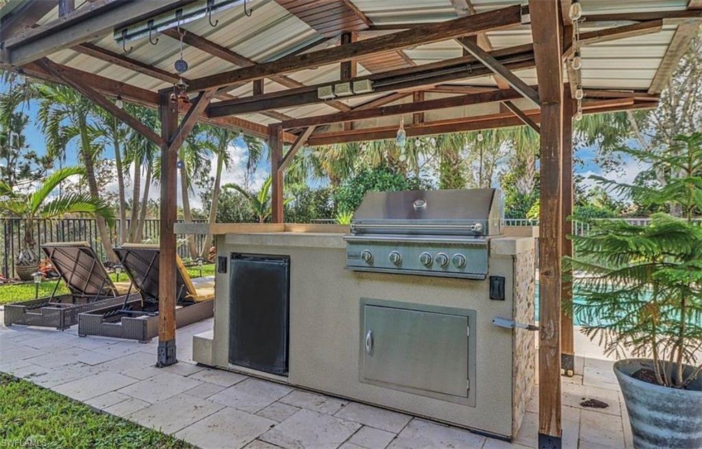 3402 Tigris Lane Naples, FL 34119 - Photo 16 of 50 a view of a patio and garden