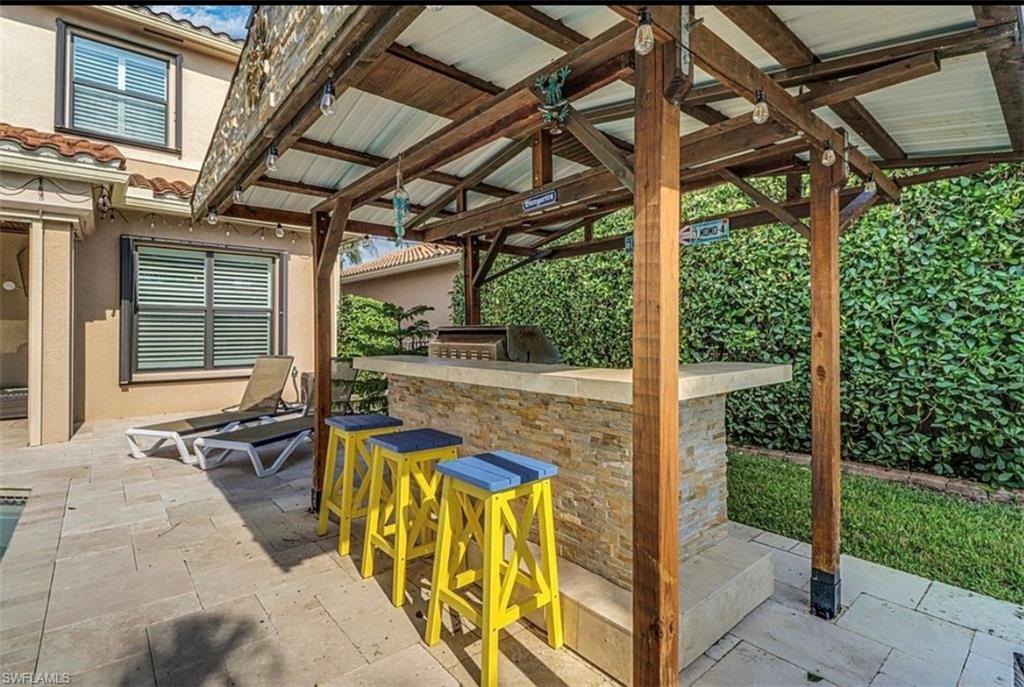 3402 Tigris Lane Naples, FL 34119 - Photo 17 of 50 a view of swimming pool with patio