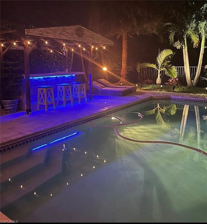 3402 Tigris Lane Naples, FL 34119 - Photo 22 of 50 a view of swimming pool