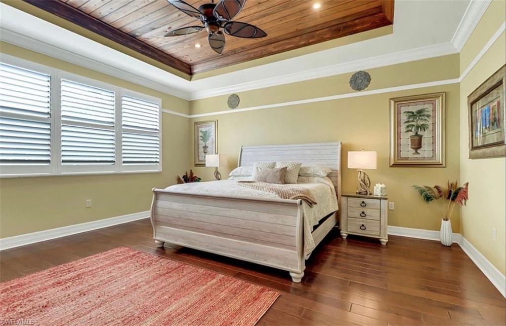 3402 Tigris Lane Naples, FL 34119 - Photo 25 of 50 a bedroom with a bed and a window