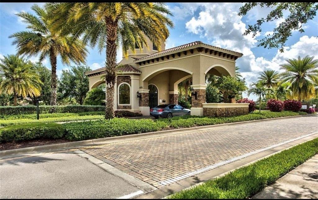 3402 Tigris Lane Naples, FL 34119 - Photo 40 of 50 a front view of a house with a yard