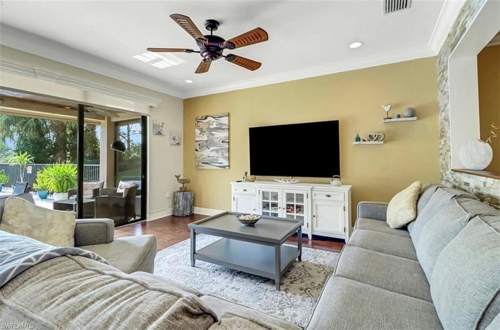 3402 Tigris Lane Naples, FL 34119 - Photo 5 of 50 a living room with furniture and a flat screen tv