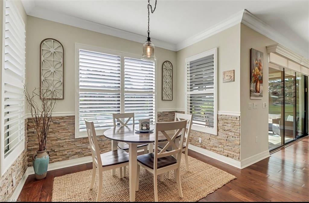 3402 Tigris Lane Naples, FL 34119 - Photo 8 of 50 a dining room with furniture and window