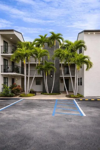 a house with potted plants in front of it
