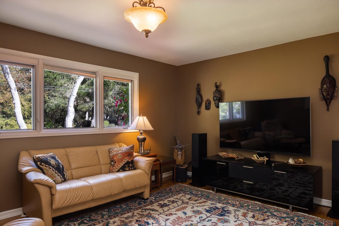 2984 Crescent Drive Pebble Beach, CA 93953 - Photo 14 of 22 a living room with furniture and a flat screen tv