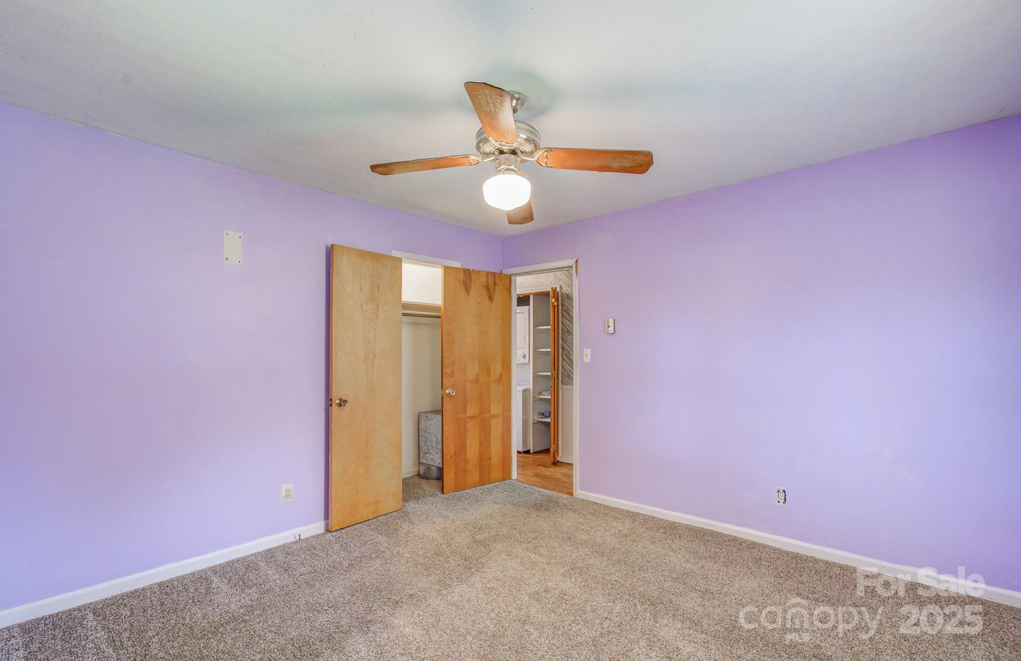 617 Oak Grove Road Kings Mountain, NC 28086 - Photo 18 of 32 an empty room with closet and a chandelier fan