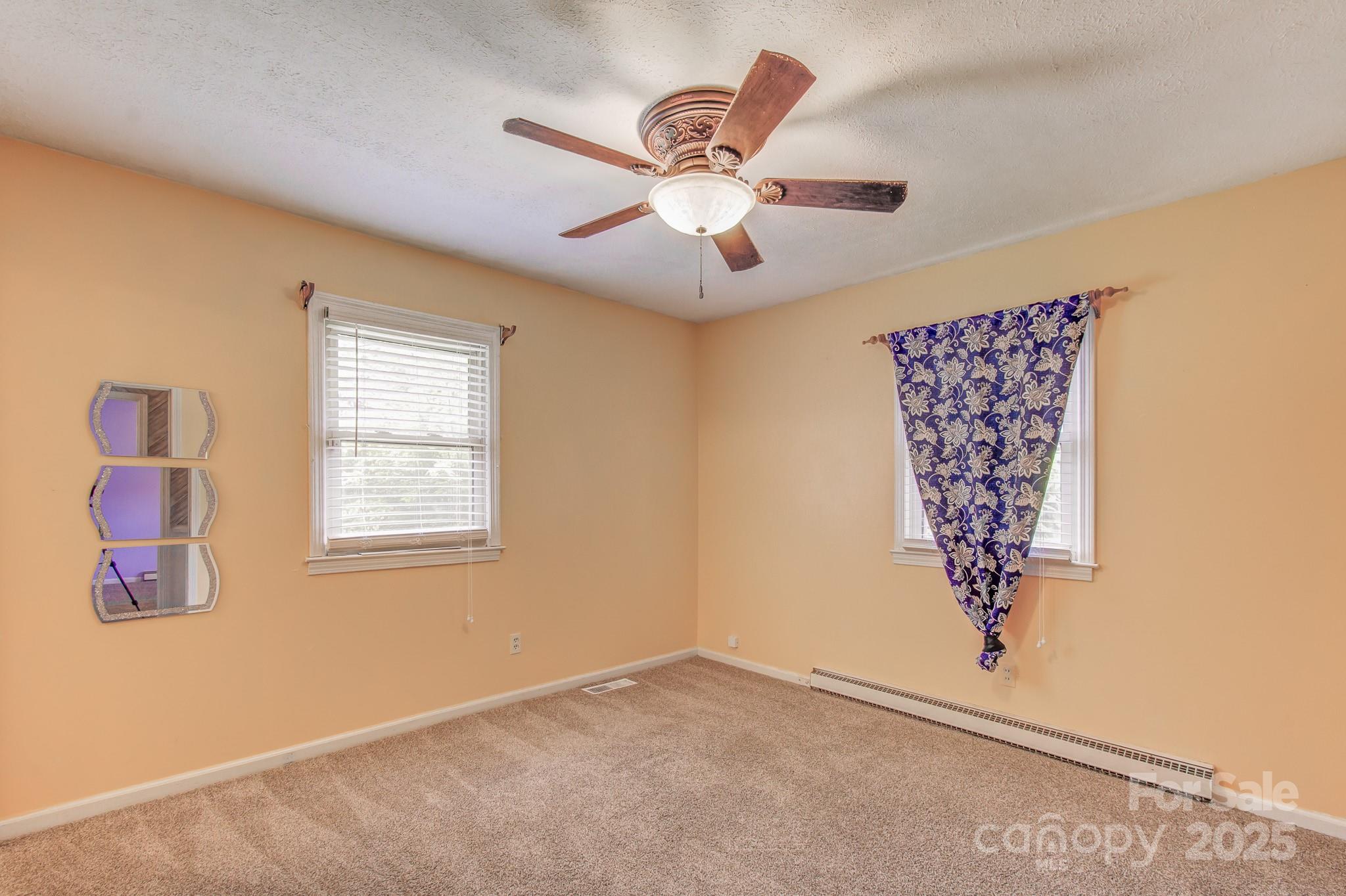 617 Oak Grove Road Kings Mountain, NC 28086 - Photo 19 of 32 an empty room with windows and fan