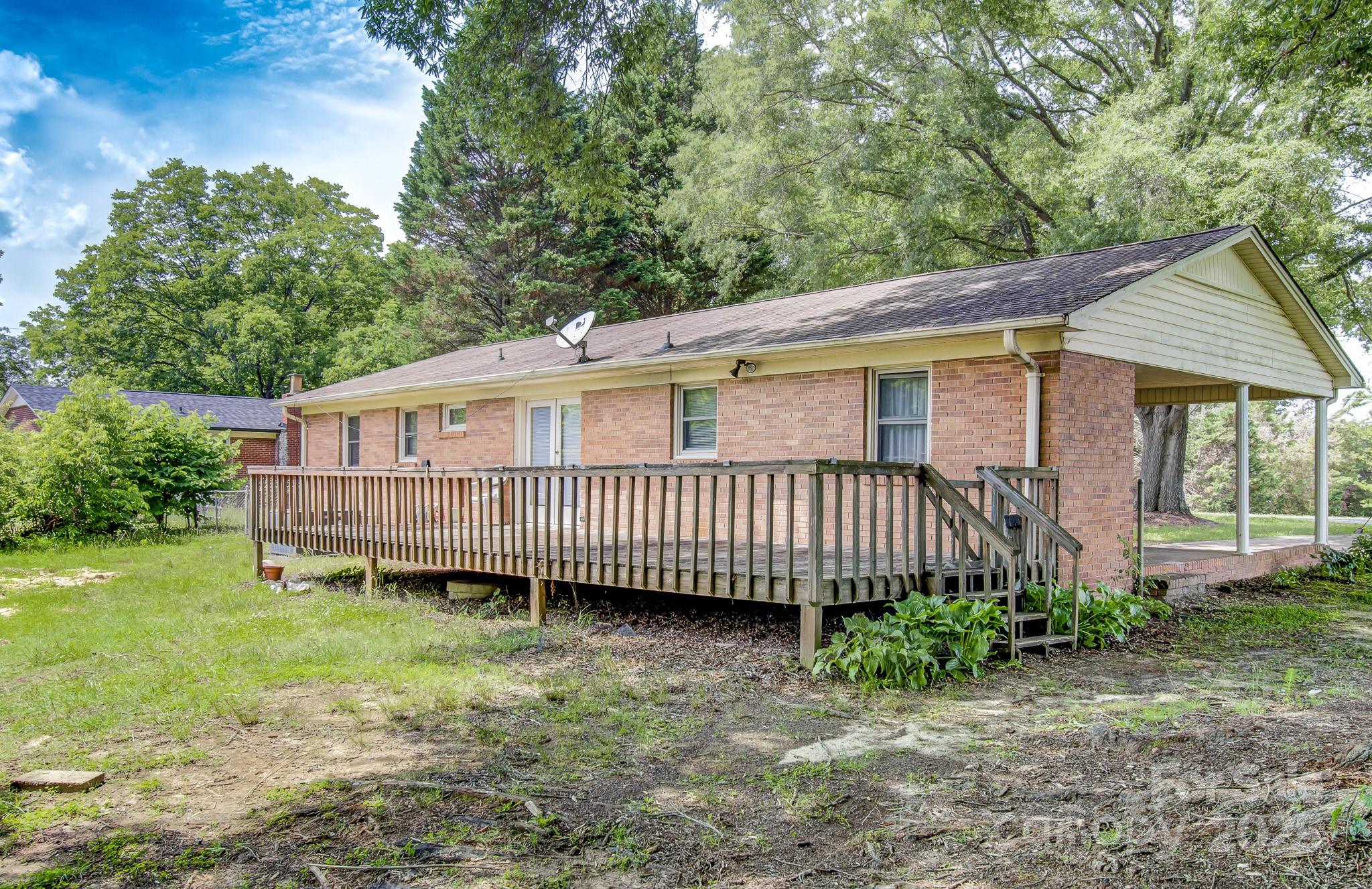 617 Oak Grove Road Kings Mountain, NC 28086 - Photo 28 of 32 a view of a house with a yard and deck