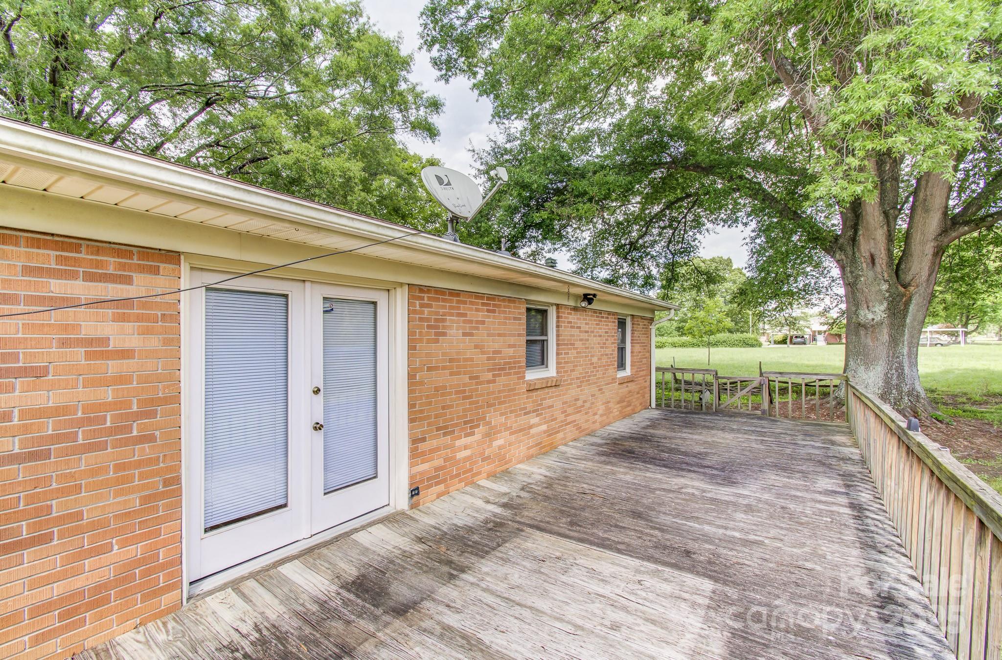 617 Oak Grove Road Kings Mountain, NC 28086 - Photo 30 of 32 a view of backyard with large tree and wooden fence