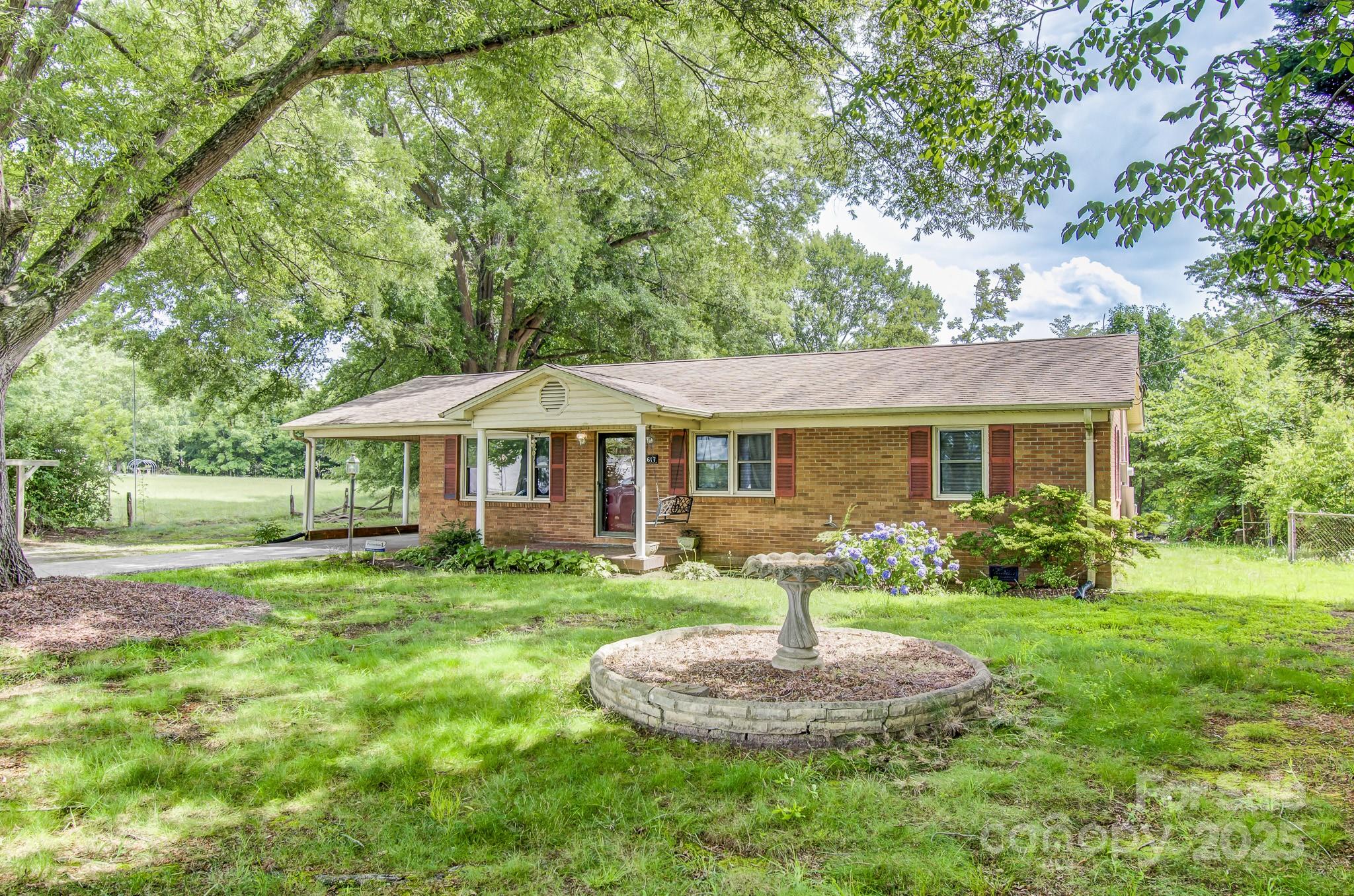 617 Oak Grove Road Kings Mountain, NC 28086 - Photo 32 of 32 a front view of house with a garden and patio