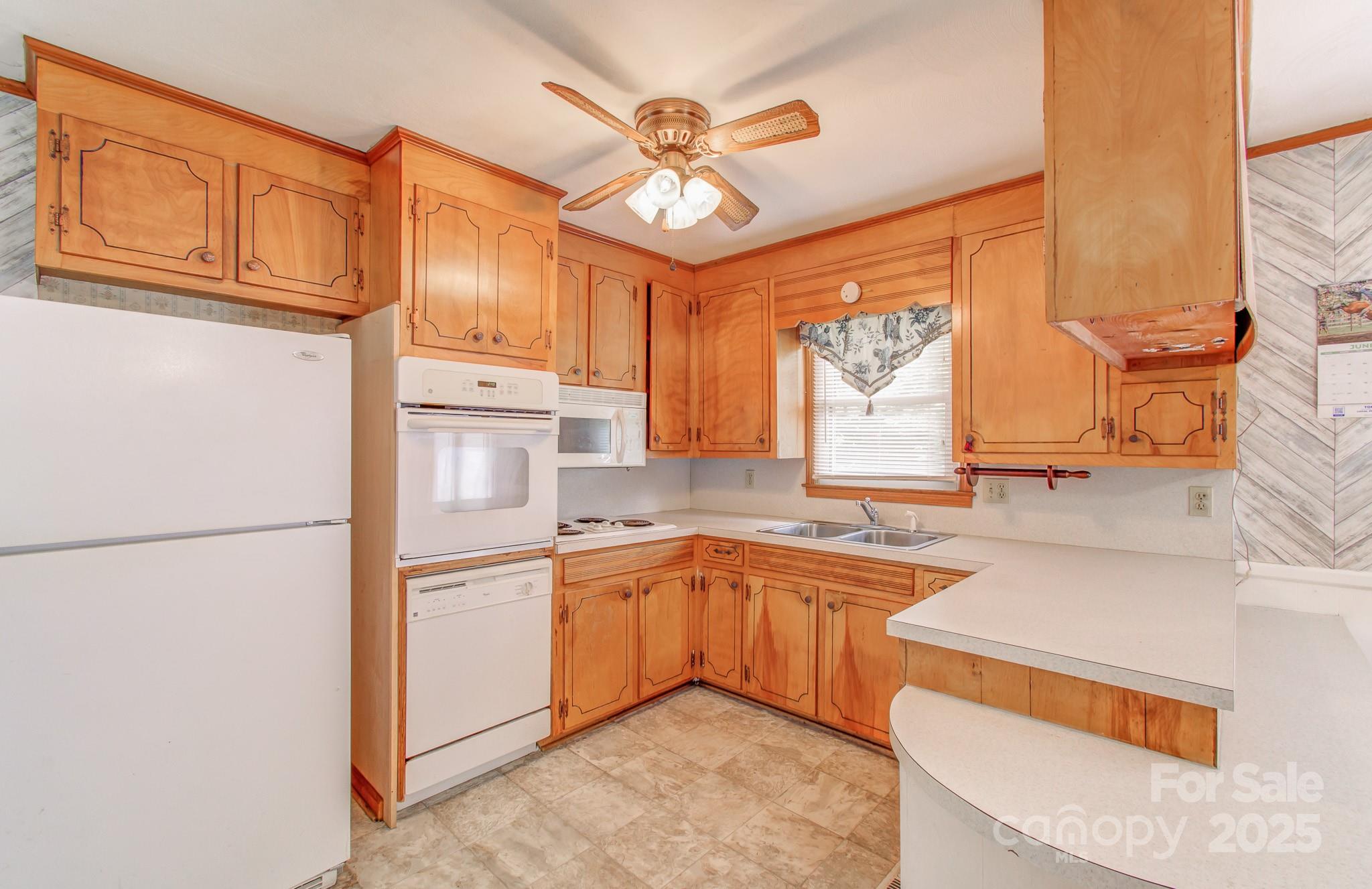 617 Oak Grove Road Kings Mountain, NC 28086 - Photo 5 of 32 a kitchen with stainless steel appliances granite countertop a sink stove and refrigerator