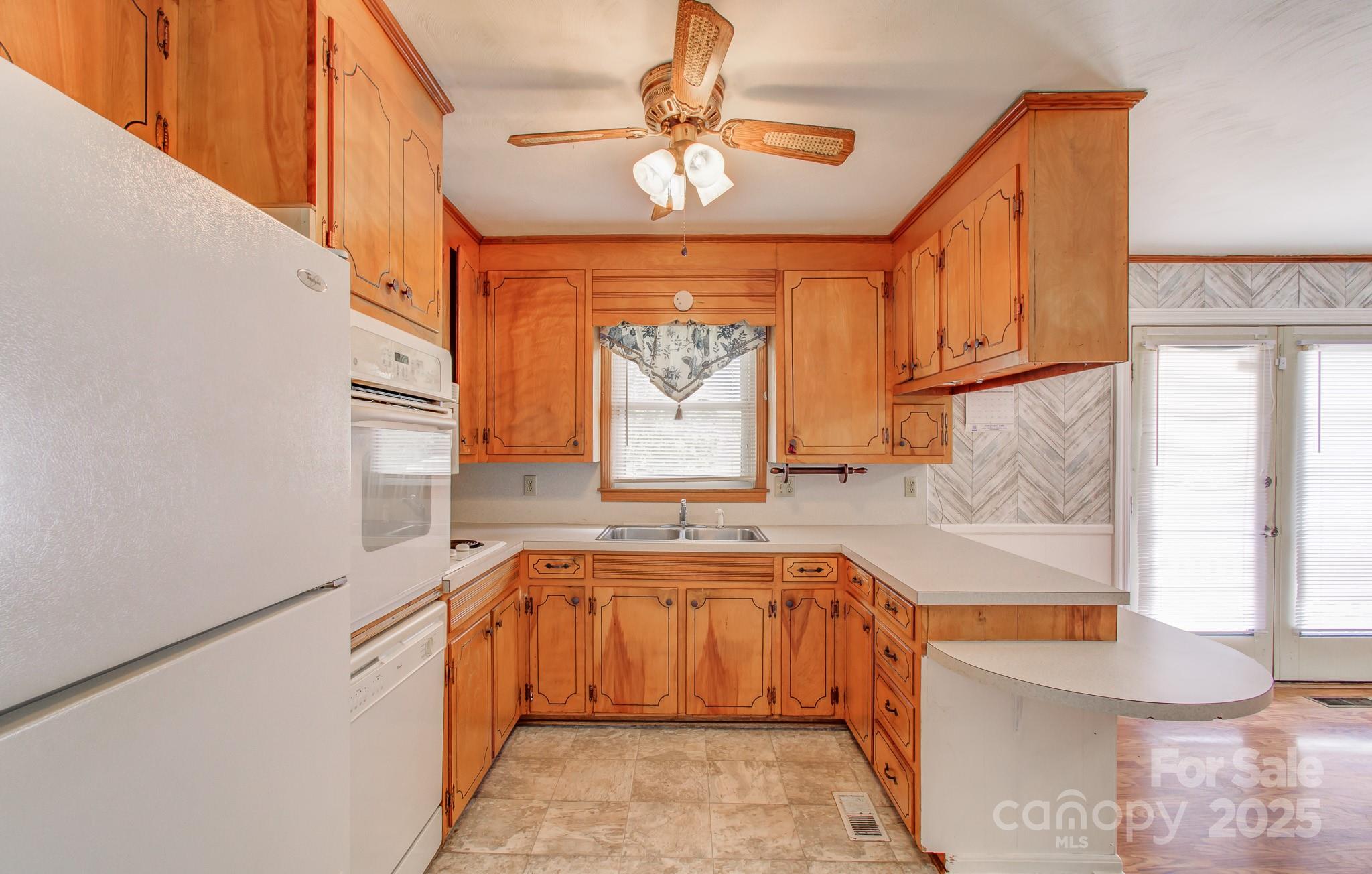 617 Oak Grove Road Kings Mountain, NC 28086 - Photo 6 of 32 a kitchen with a sink window and cabinets
