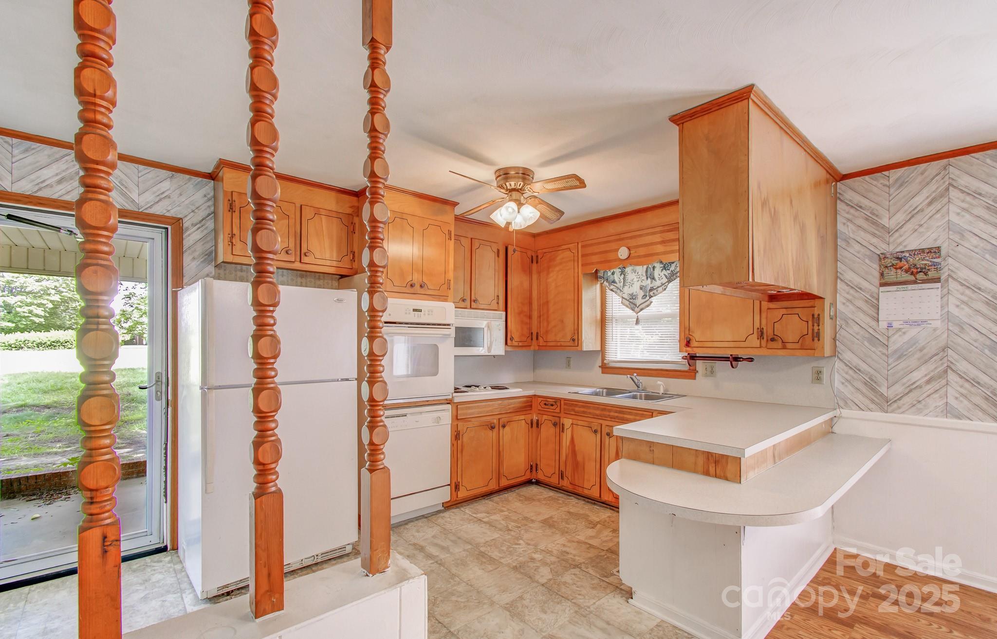 617 Oak Grove Road Kings Mountain, NC 28086 - Photo 7 of 32 a kitchen with stainless steel appliances granite countertop a sink and a refrigerator
