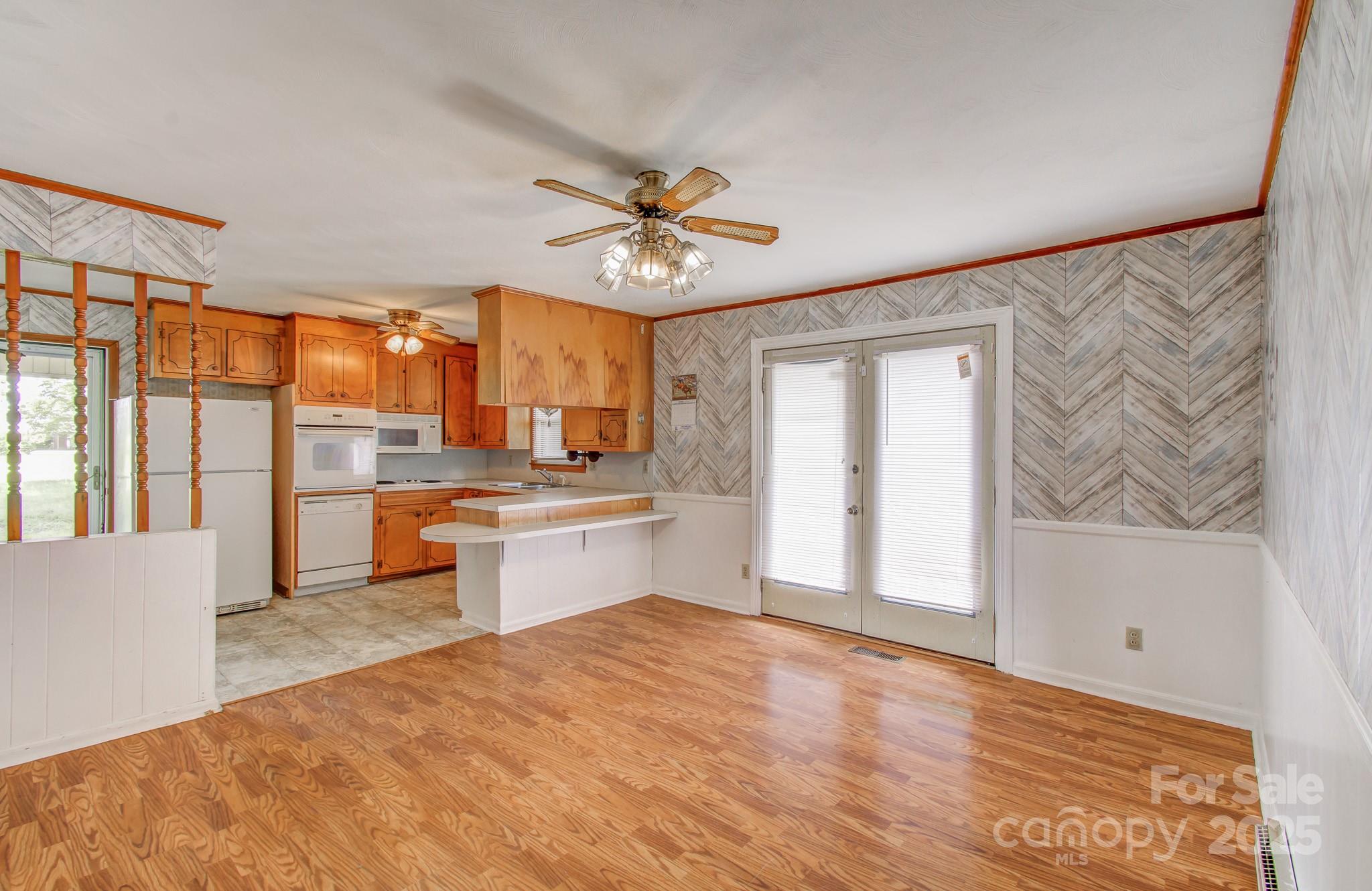617 Oak Grove Road Kings Mountain, NC 28086 - Photo 9 of 32 a large kitchen with kitchen island a sink stainless steel appliances and cabinets