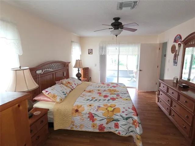 a spacious bathroom with a granite countertop sink a mirror and a